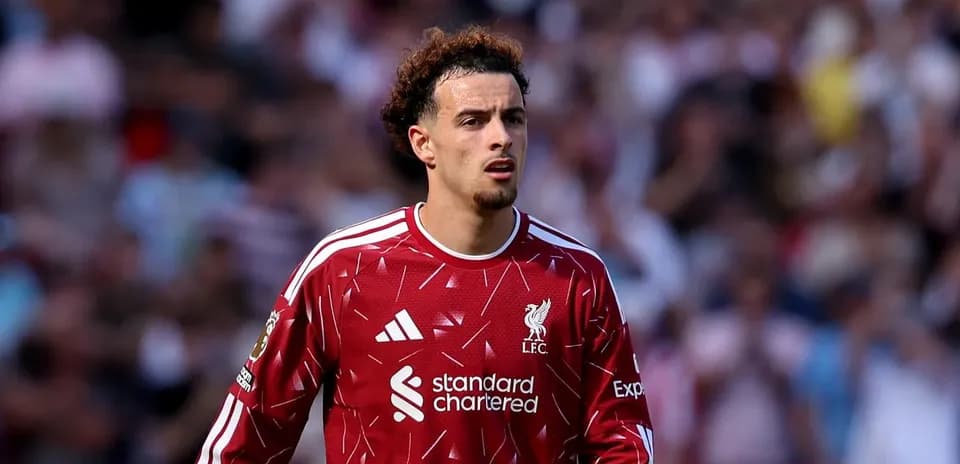 Player in Liverpool jersey on the pitch