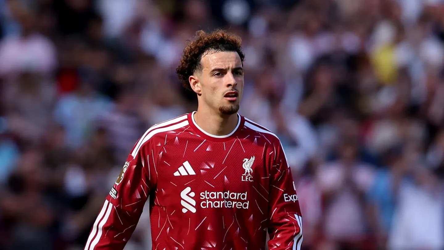 Player in Liverpool jersey on the pitch