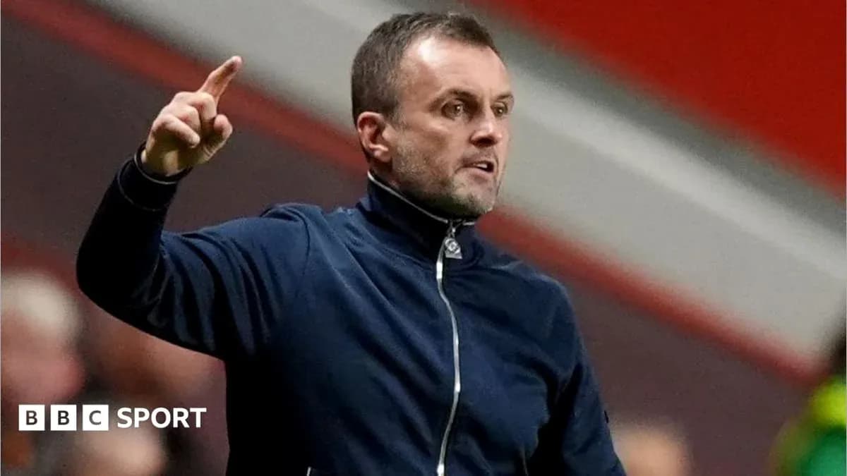 Coach gesturing during a football match
