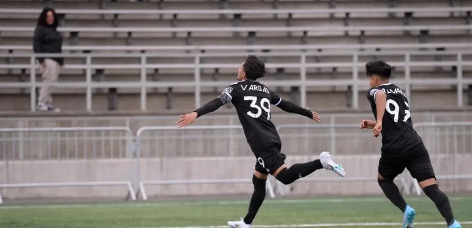 Players celebrating a goal during match