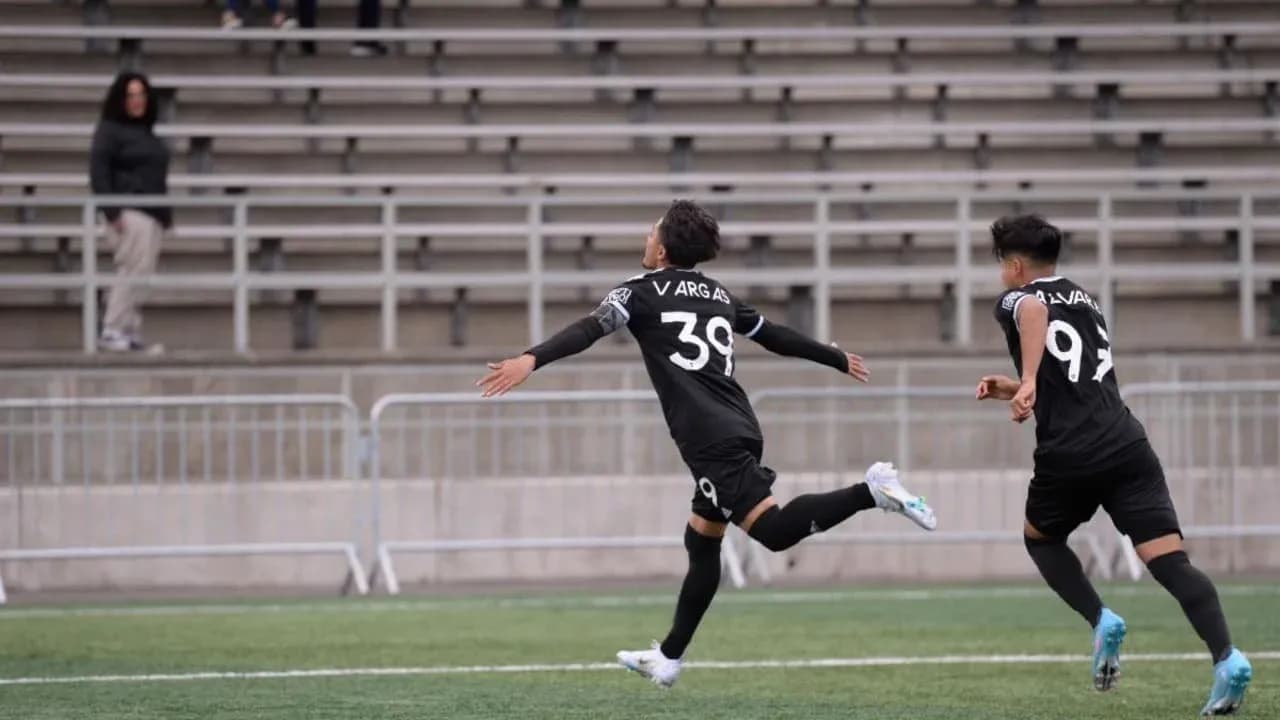 Players celebrating a goal during match