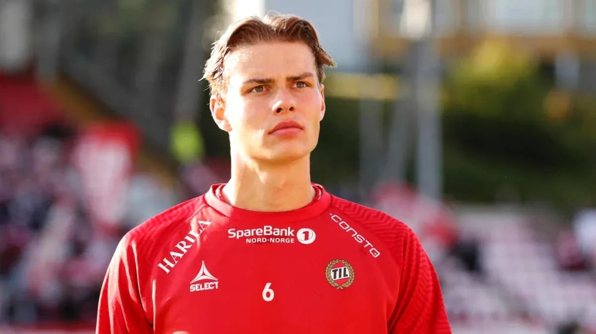 Player in red jersey during match warm-up