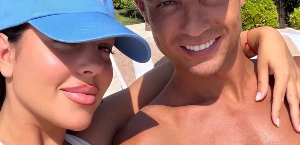 Couple posing for selfie by the pool