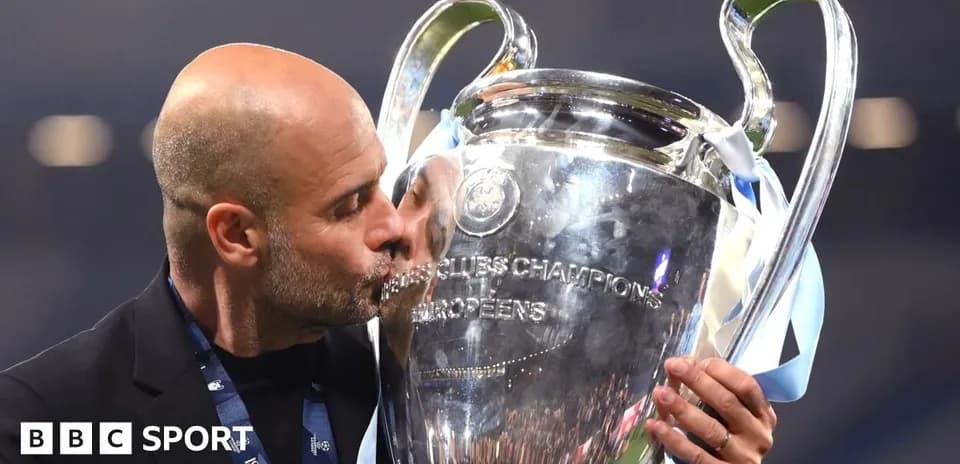 Coach kissing UEFA Champions League trophy