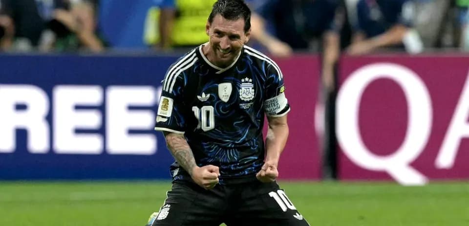 Lionel Messi celebrating on the pitch after scoring