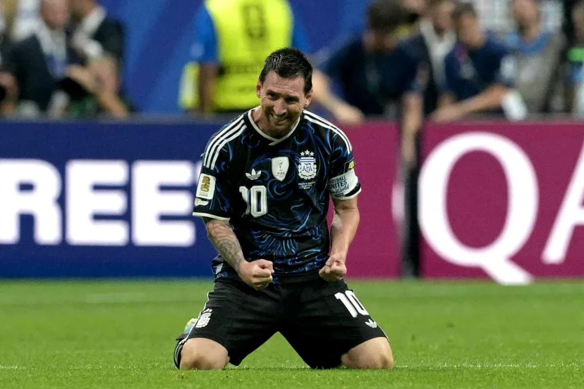 Lionel Messi celebrating on the pitch after scoring