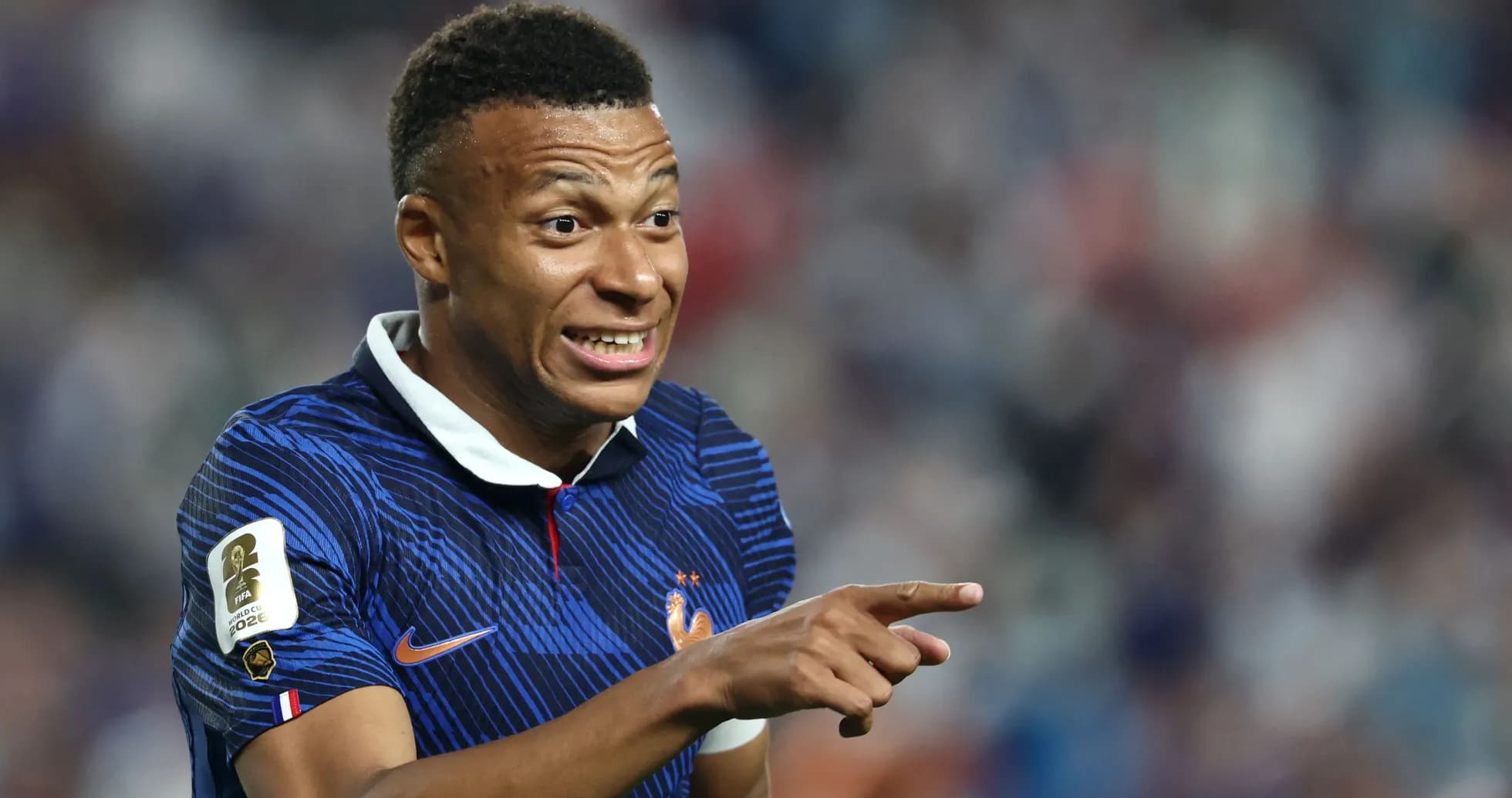 Player gesturing during a match in France kit