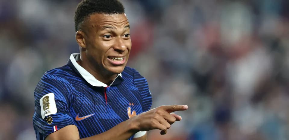 Player gesturing during a match in France kit
