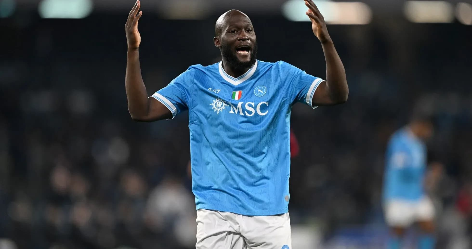 Player celebrating in Napoli's blue jersey during match