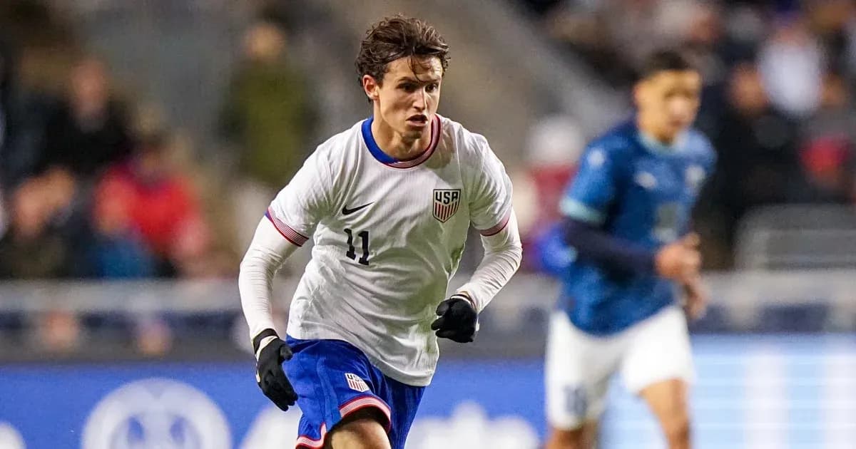 Player wearing USA jersey sprinting on field