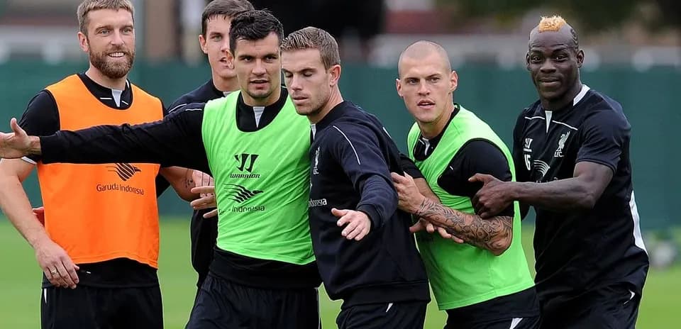 Liverpool players training in team jerseys and vests
