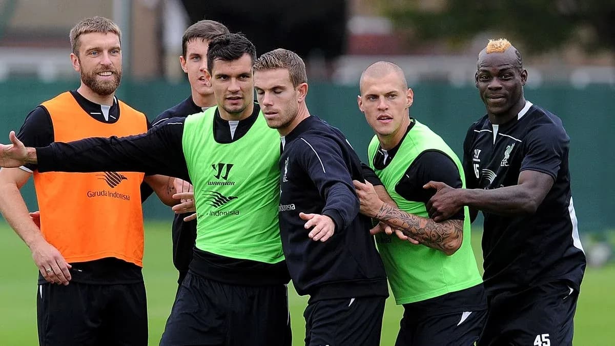 Liverpool players training in team jerseys and vests