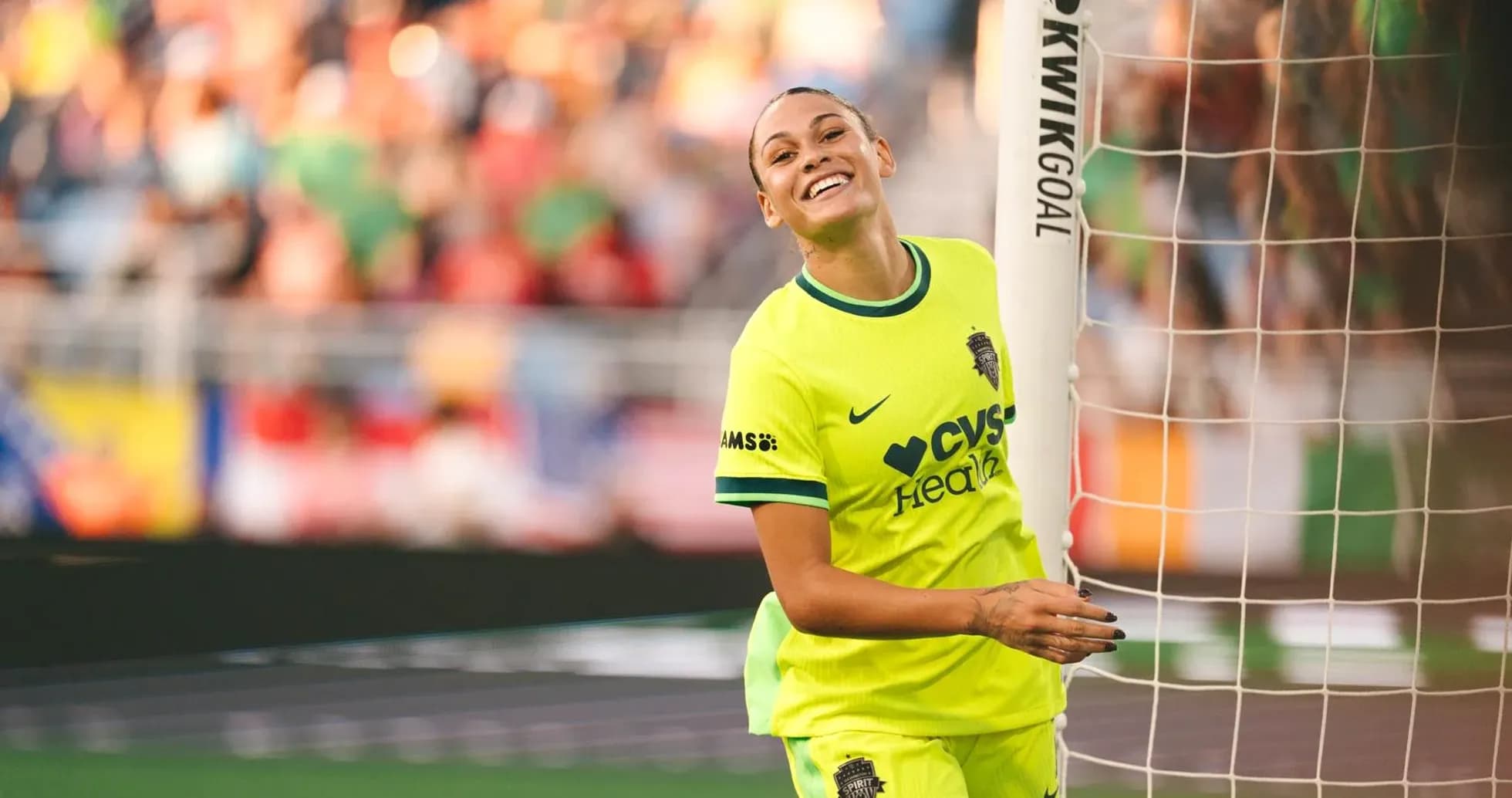 Player celebrating near goalpost during match
