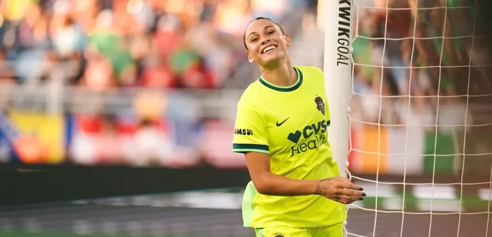 Player celebrating near goalpost during match