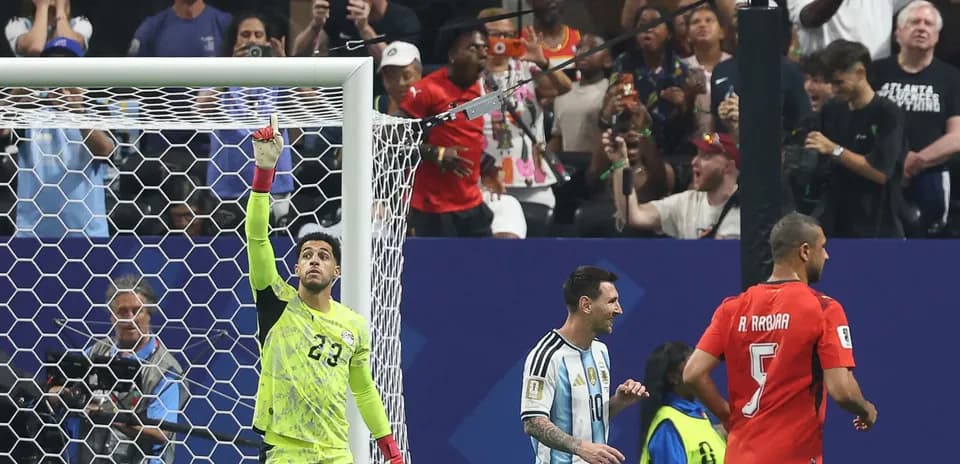 Goalkeeper celebrating with players after a save