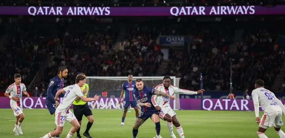 Players battling for the ball during PSG match