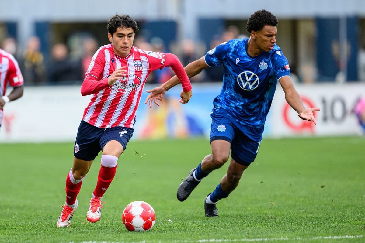 Players competing for the ball in match