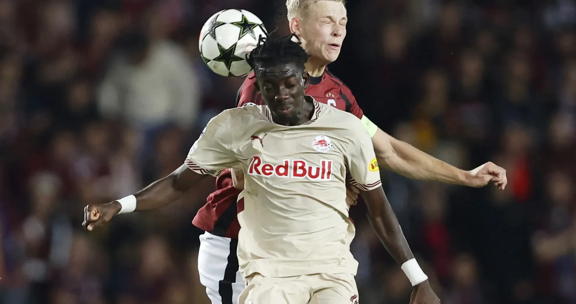 Players competing for the ball in Europa League match
