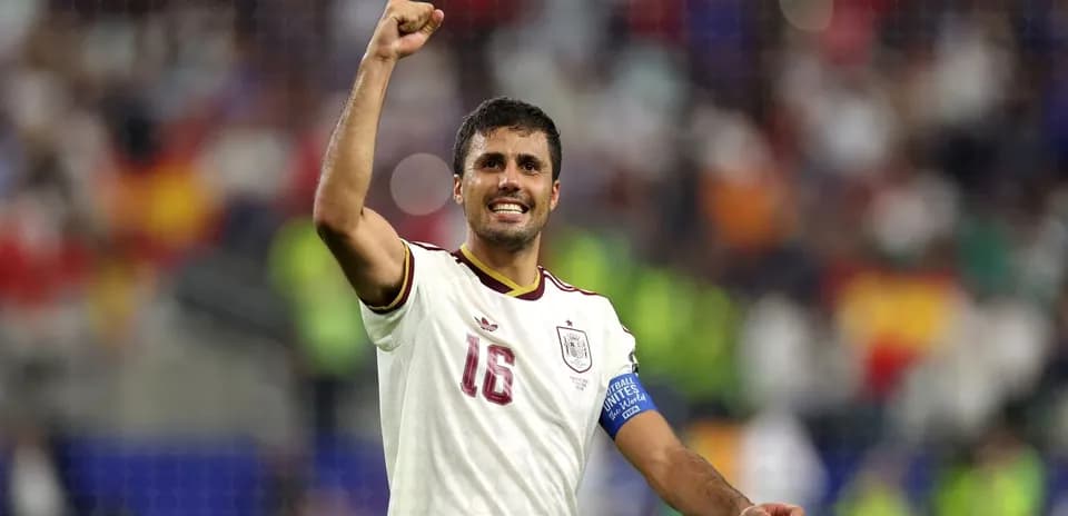 Player celebrating victory with raised fist and smile