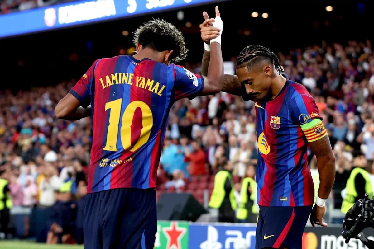 Lamine Yamal celebrating with teammate at Camp Nou