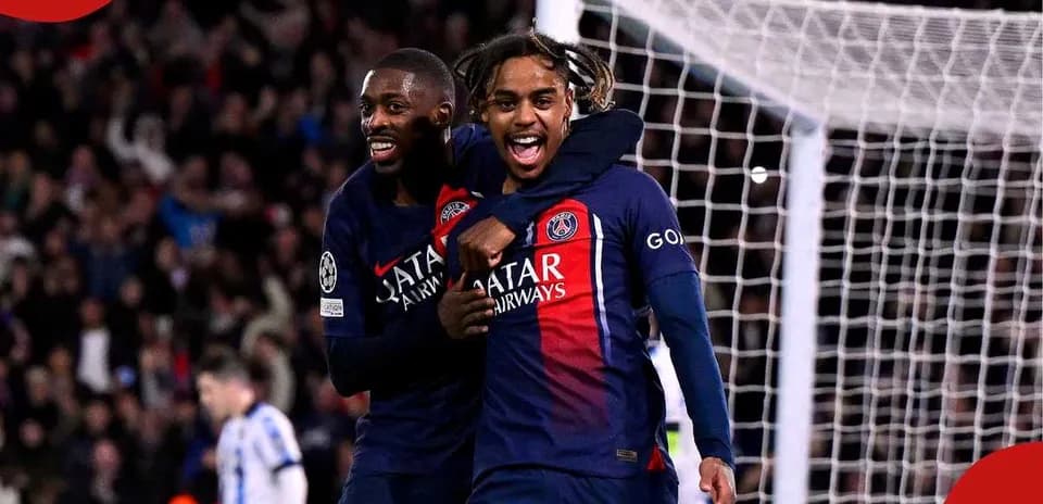 Two PSG players celebrating a goal together