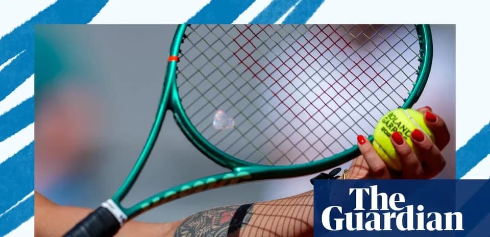 Tennis player holding racket and ball close-up