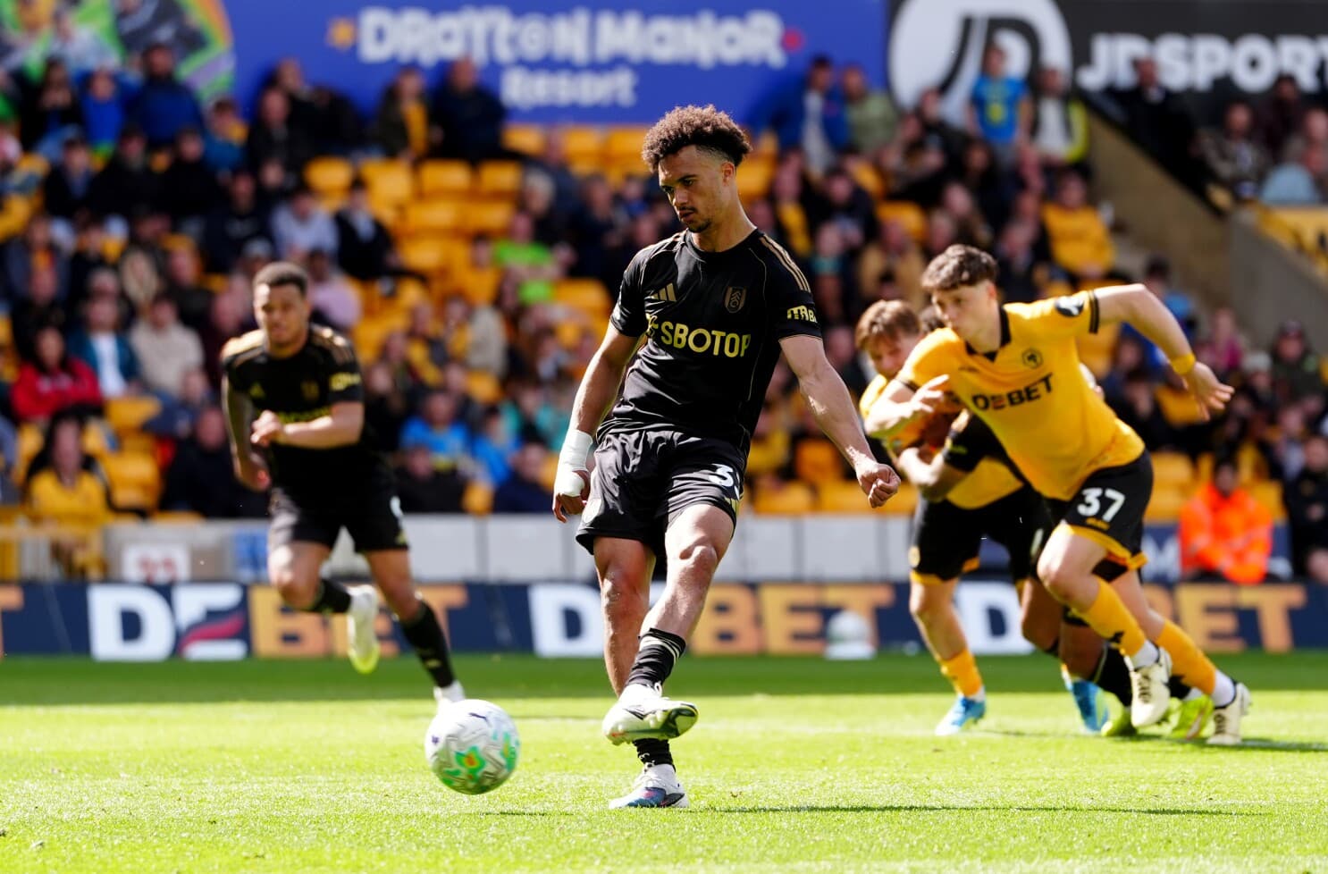 Wolves player taking a penalty kick