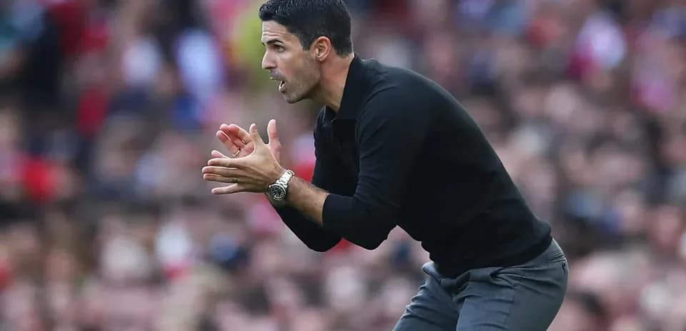 Manager gesturing during match on the sideline