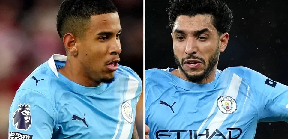 Two Manchester City players in action during match