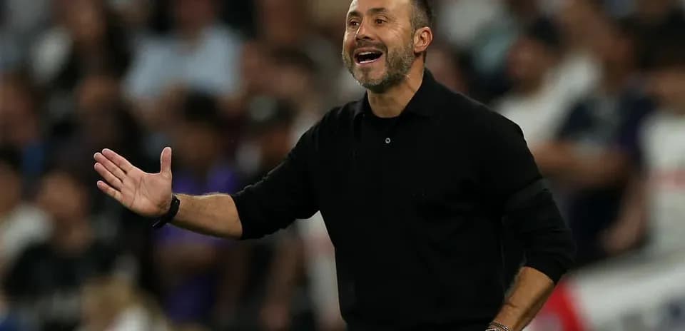 Coach gesturing during a match on the sidelines
