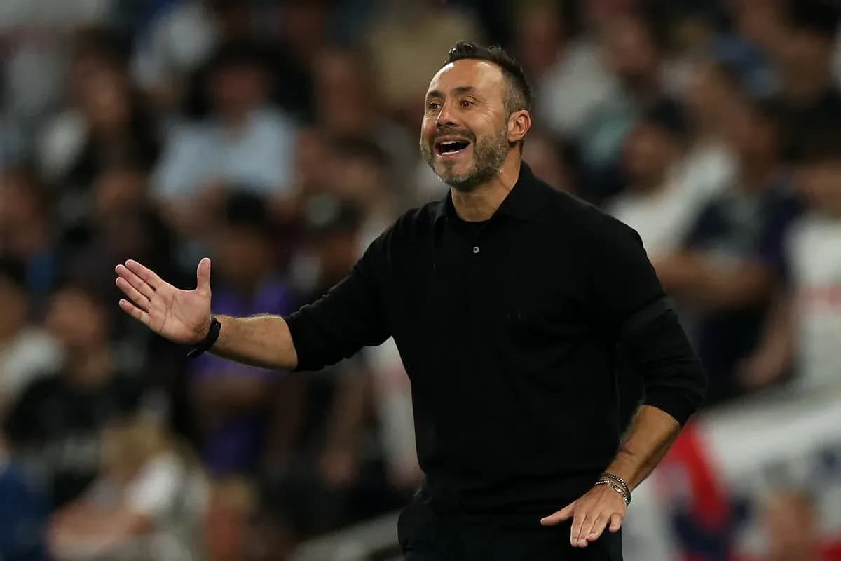 Coach gesturing during a match on the sidelines