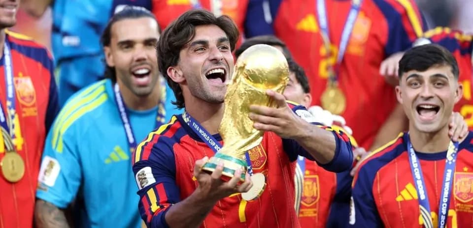 Player celebrating with FIFA World Cup trophy
