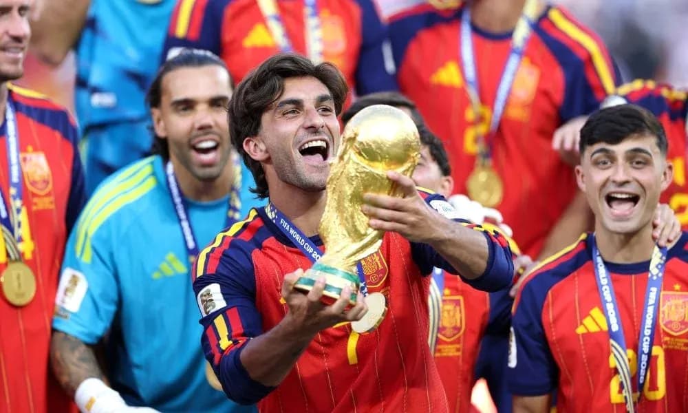 Player celebrating with FIFA World Cup trophy