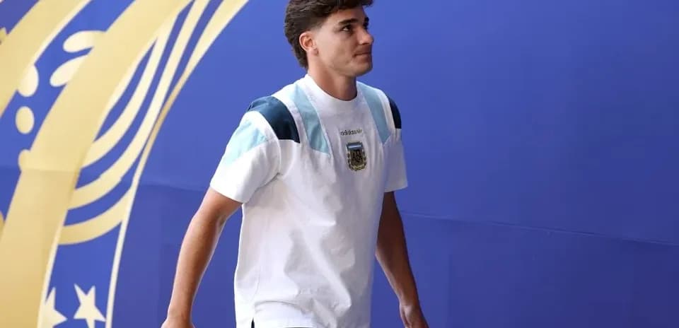 Player walking towards venue with team shirt