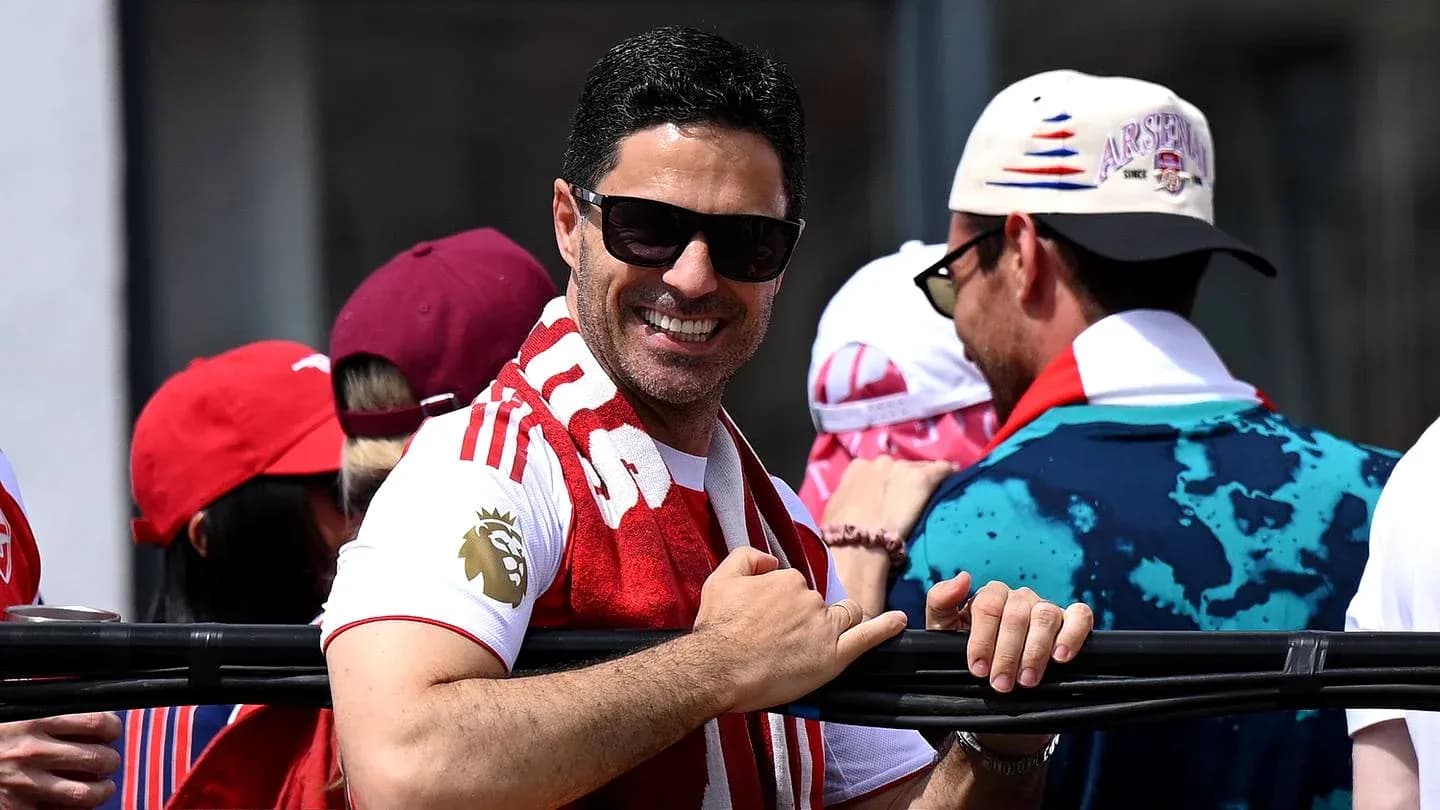 Man in sunglasses smiling at a celebration event