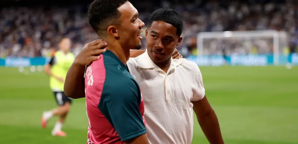 Two players embracing on the football pitch