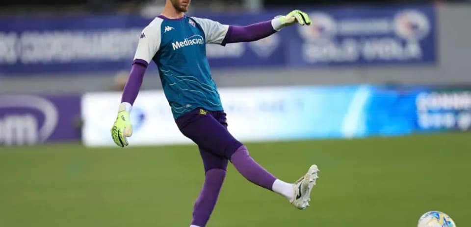 Goalkeeper performing a kick during warm-up session