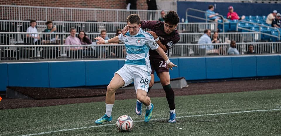 Chicago Fire II player dribbling against Carolina Core