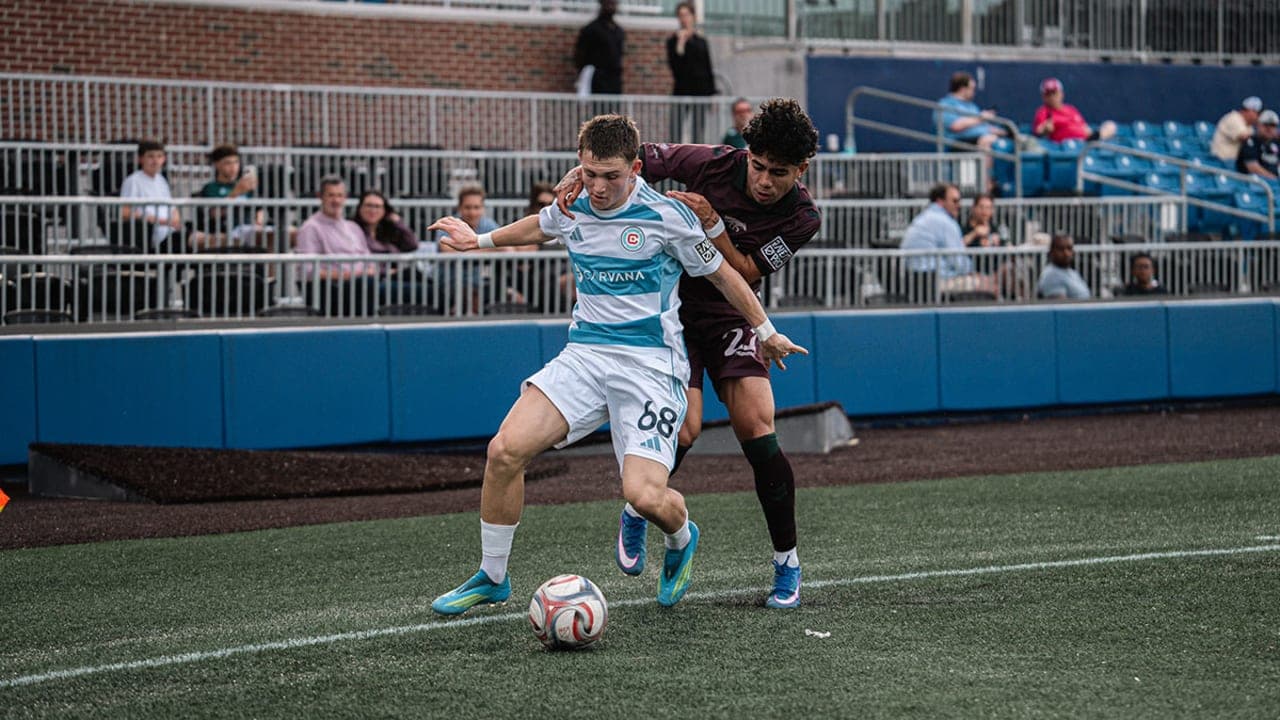 Chicago Fire II player dribbling against Carolina Core
