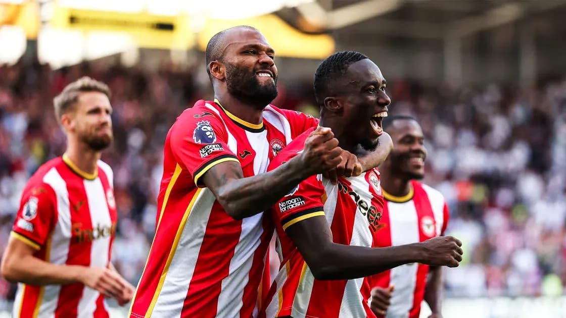 Brentford players celebrating a goal on the pitch