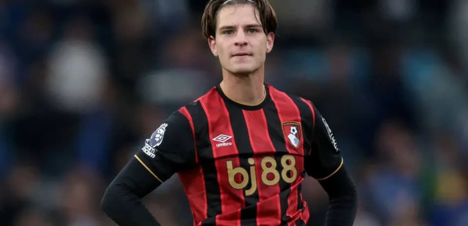 Bournemouth player wearing home kit on field