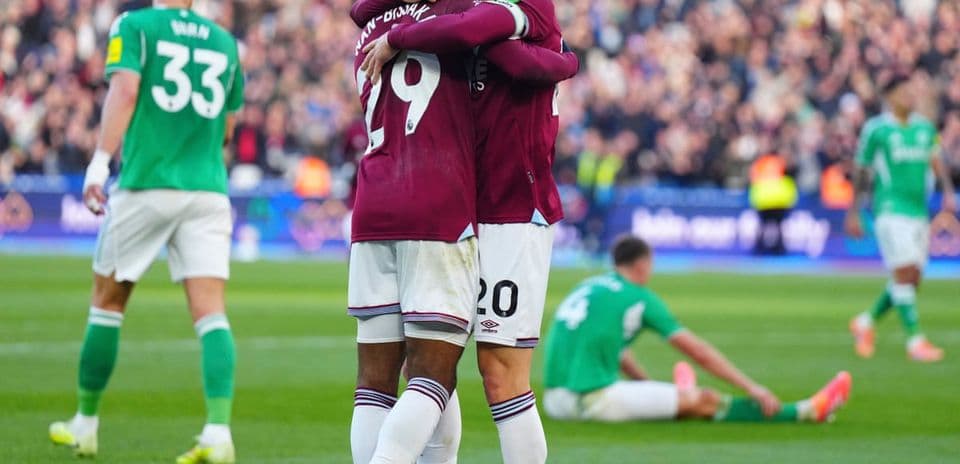 Players celebrating a goal during match