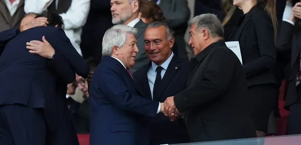 Officials shaking hands in the stands during event