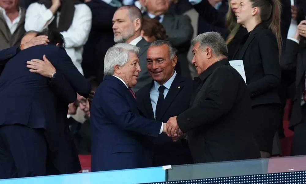 Officials shaking hands in the stands during event