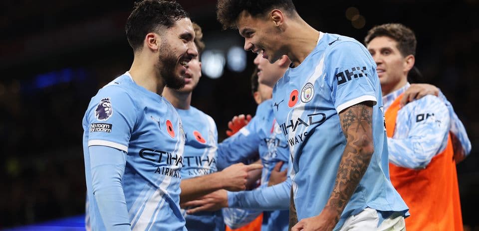 Manchester City players celebrating a goal