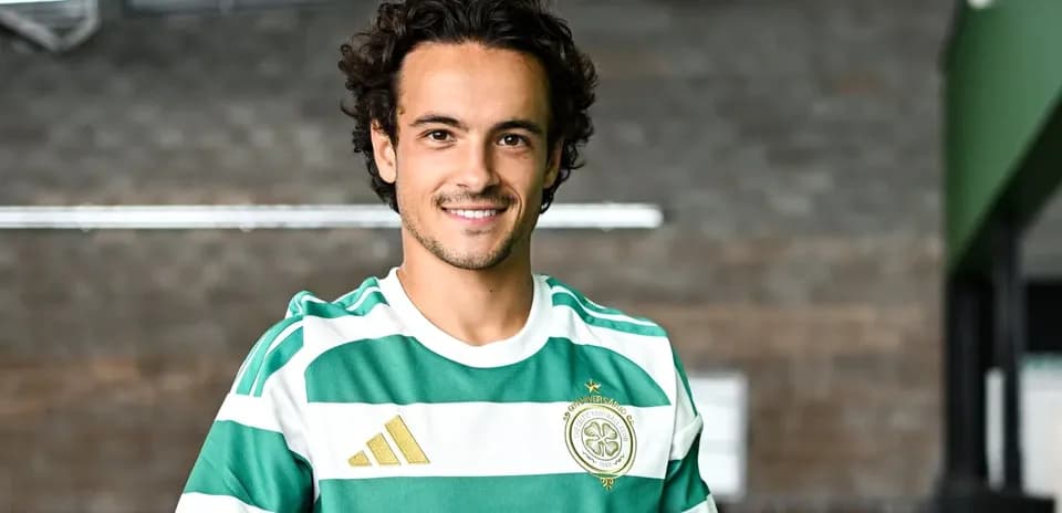 Player wearing Celtic FC kit and smiling