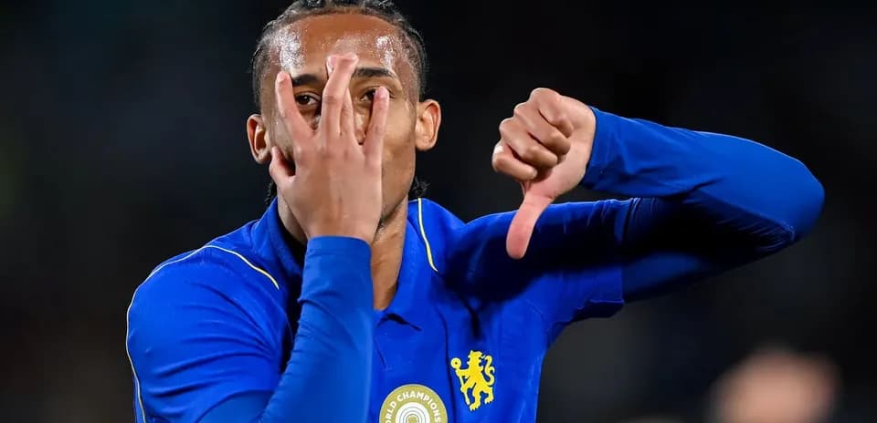 Player celebrating with hand gestures in blue jersey