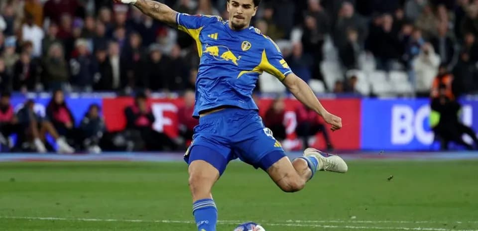 Player kicking ball during a football match