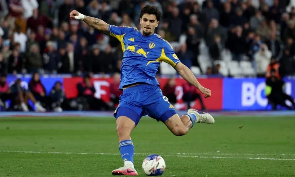 Player kicking ball during a football match