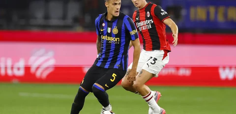 Two players contesting for the ball during match